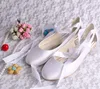 white satin ballet shoes with ribbon