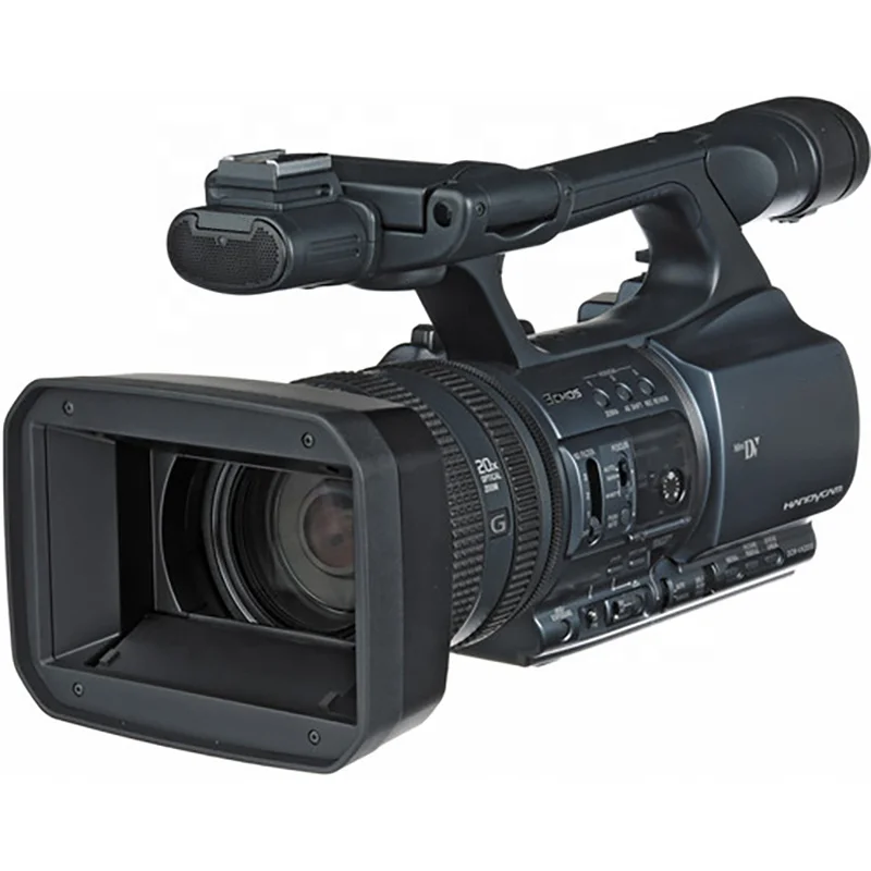 Close-up of Hi8 tape being loaded into Sony Handycam with visible tape path and video head drum