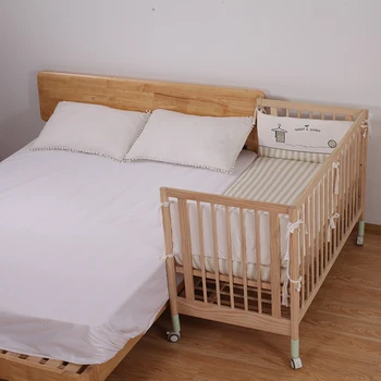 crib by bed