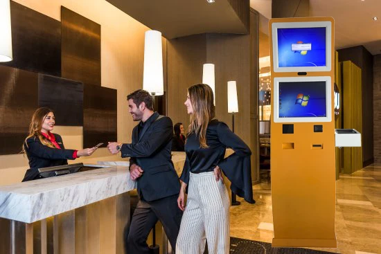 Touchscreen self service hotel check in kiosk with card reader
