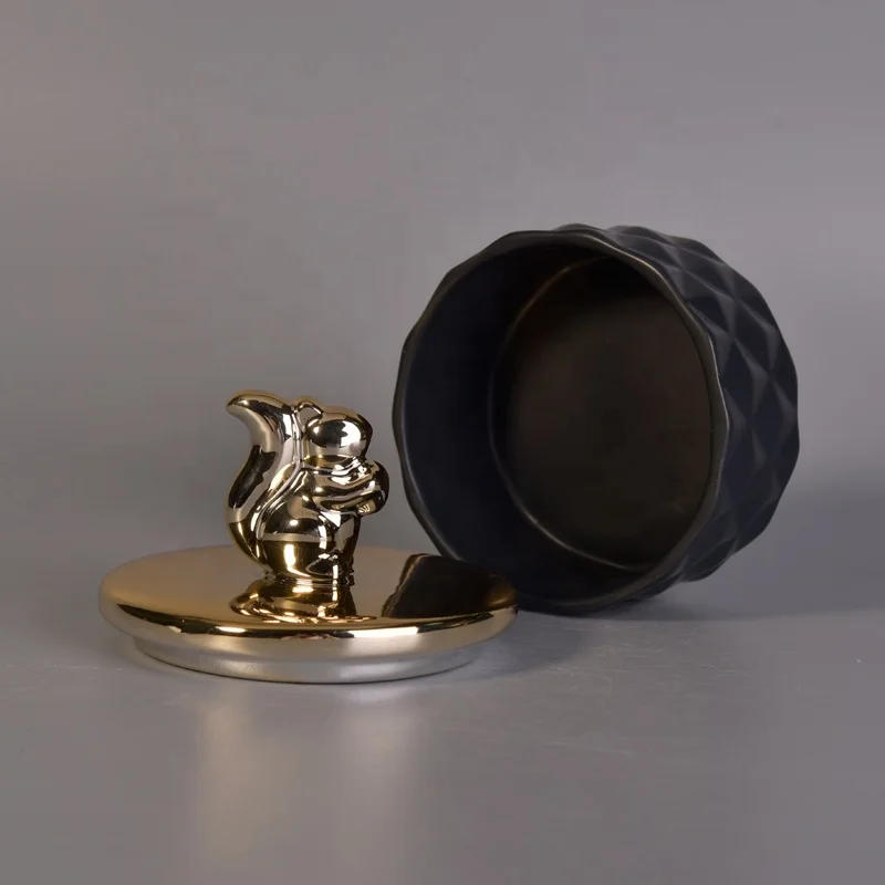 Unique black ceramic candle holder with gold lid for home decor