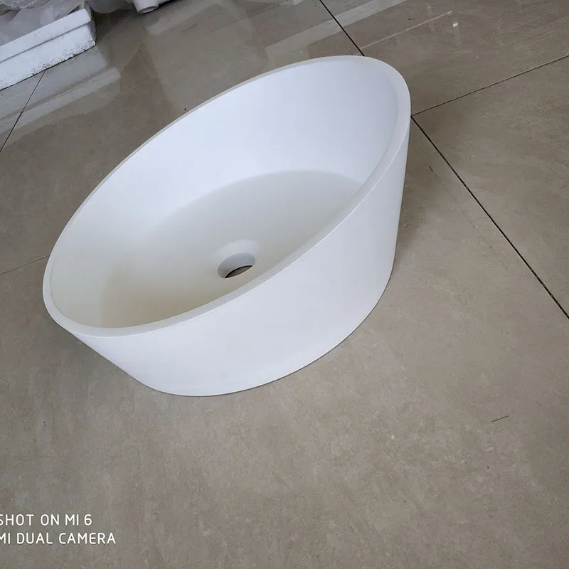 China Manufacturer Wholesale Cheap hotel bathroom vanity sink irregular round solid surface sink wash basin
