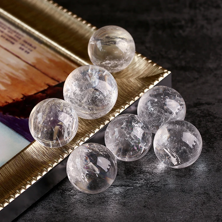
China Manufacturer Clear 40mm Simple Modern Round Glass Snow Inside Crystal Ball with Wooden Base 