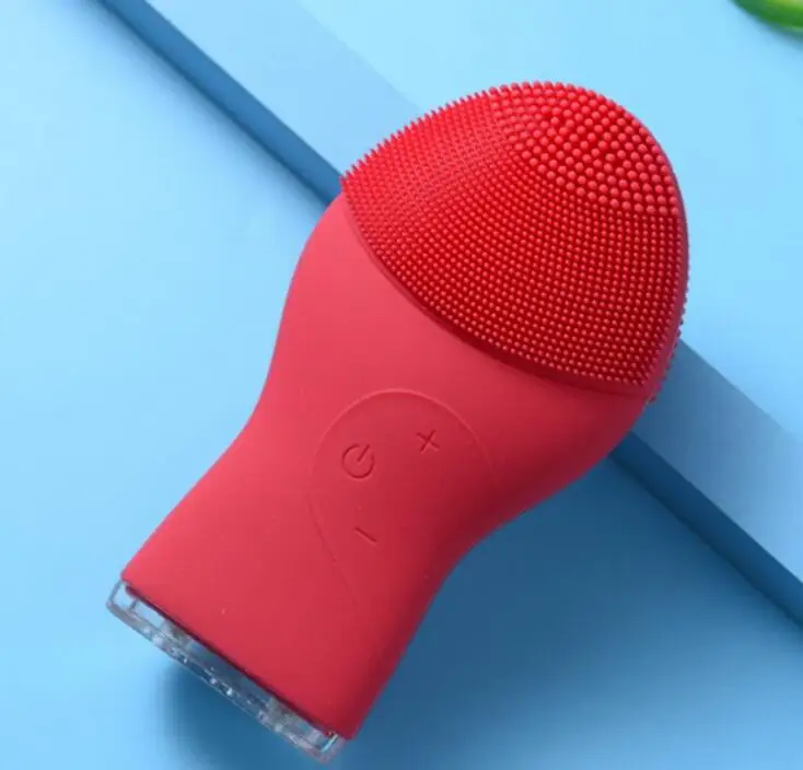 Red silicone face brush.jpg