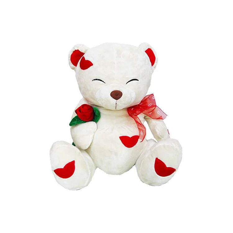 teddy bear with red scarf
