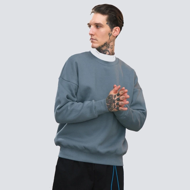 crewneck sweatshirt with collared shirt underneath