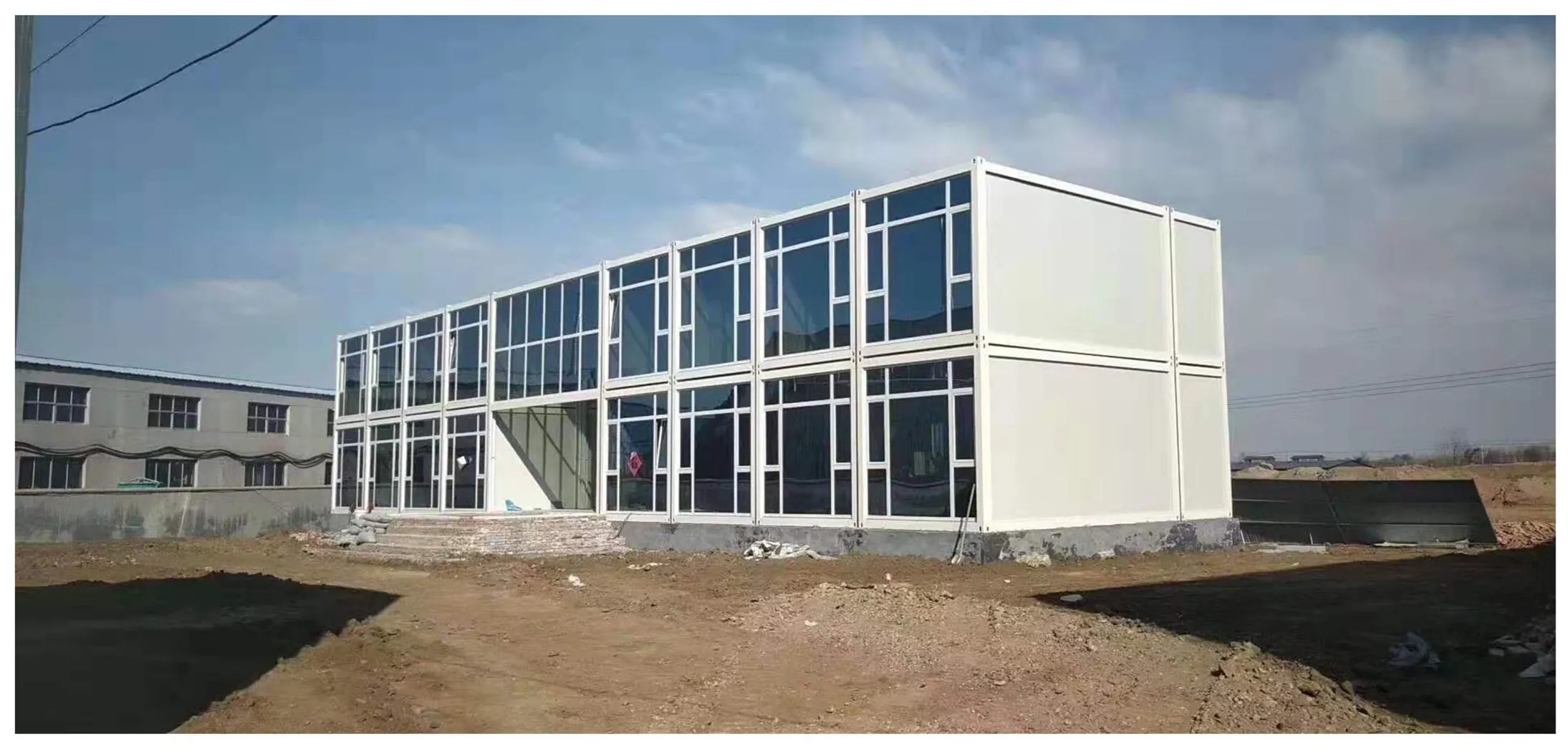 prefab flat pack container house construction site