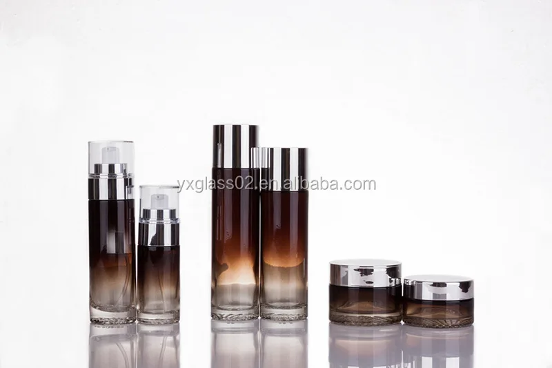 Luxury Cosmetic glass bottle set -- skincare container manufacturer-- new style design with pump&spray&gold/aluminum cap supplier