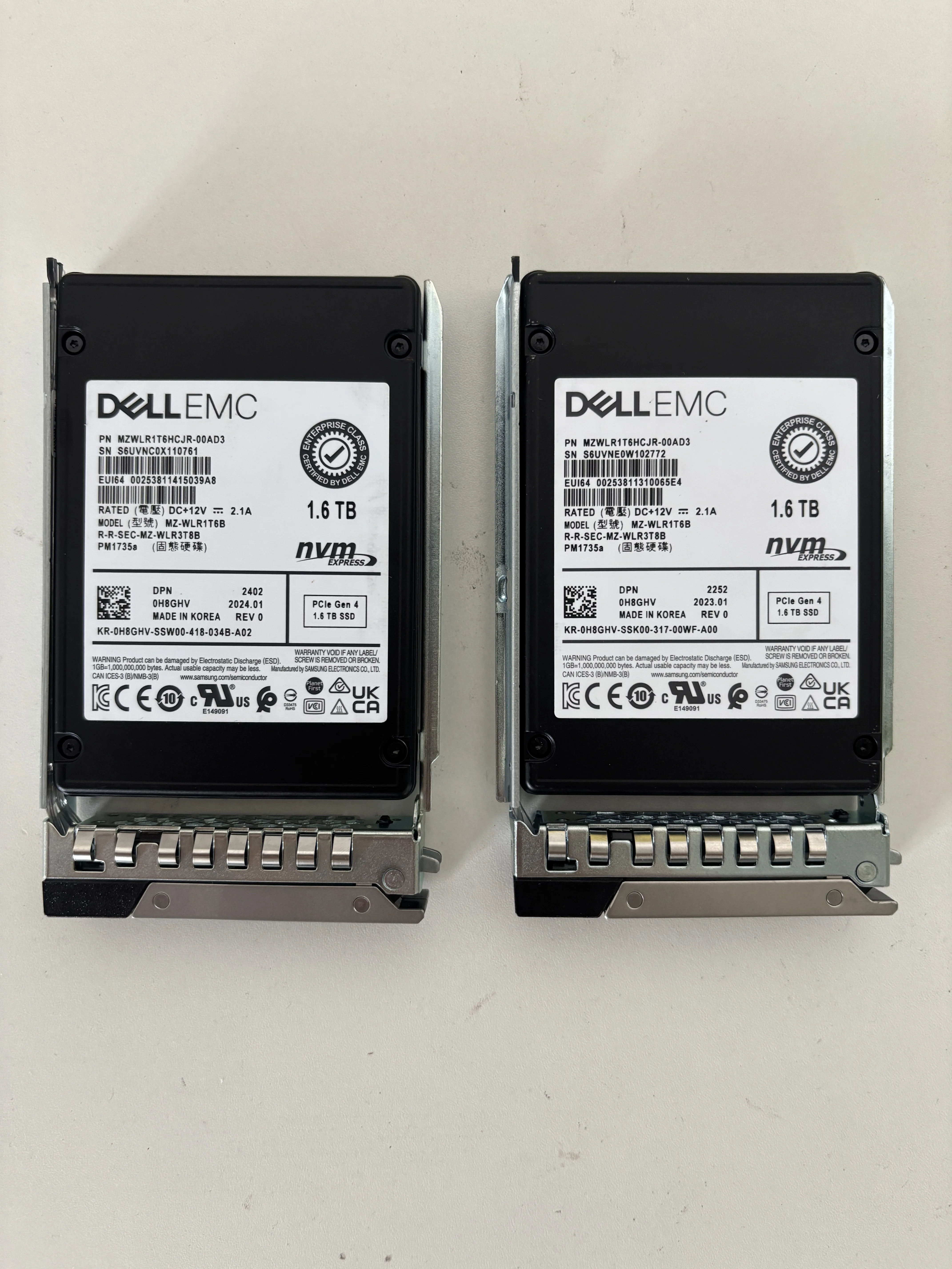 Close-up of 30 TB HAMR hard drive showing label, SATA/SAS connector, and heat sink