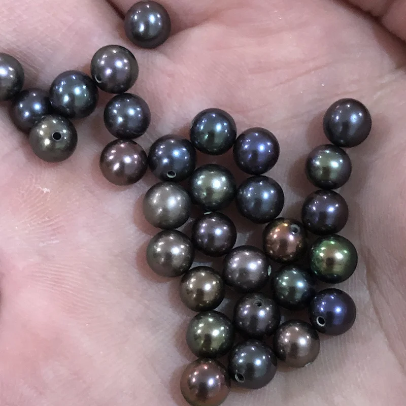
wholesale black freshwater pearl,round,good luster,very clean surface,beautiful peacock colors 