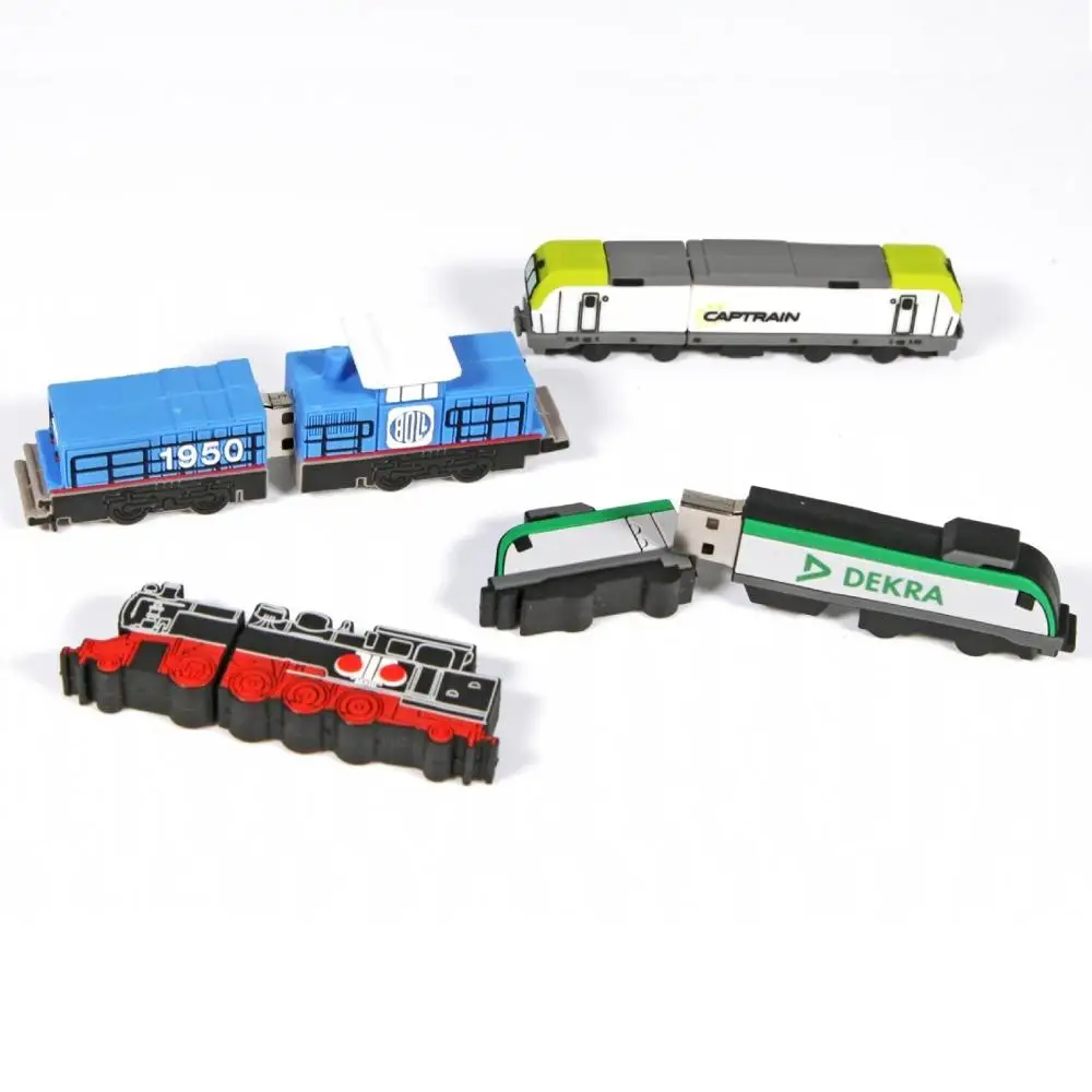 Green cartoon train USB drive next to paper tickets and miniature train set