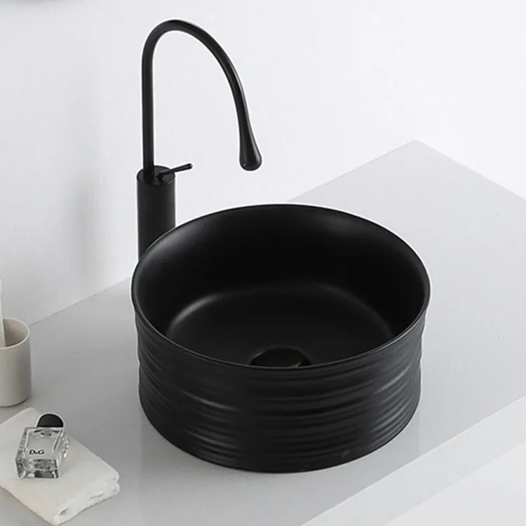 Matte black bathroom ceramic relief round circular wash art basin for sale