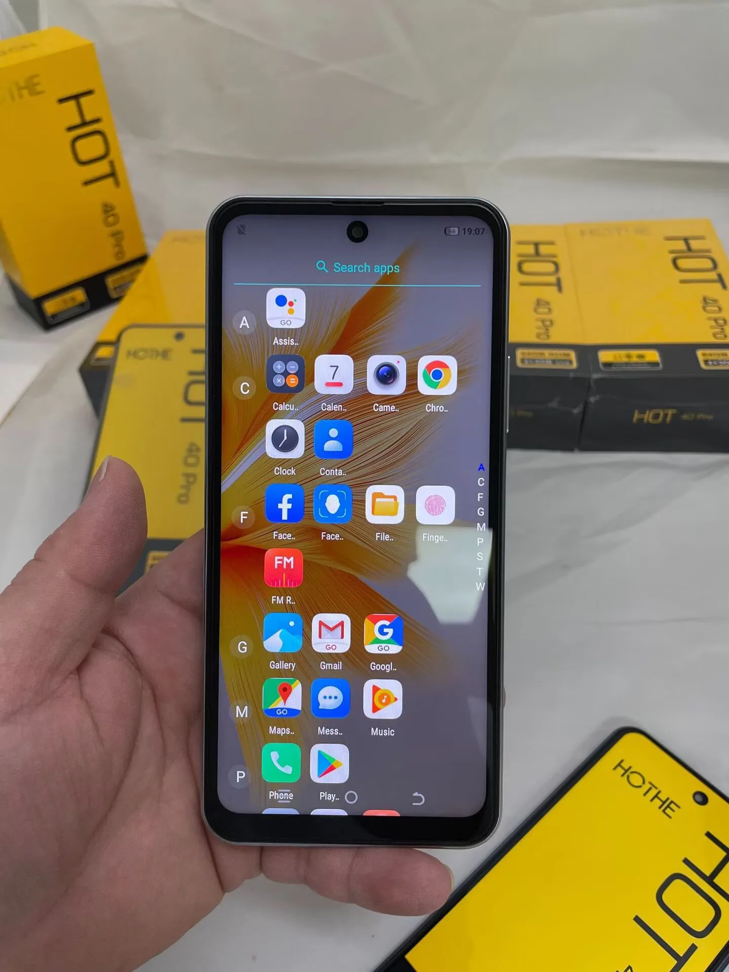 Bulk smartphone packaging with labeled cartons and serial number tags