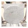 Round marble slab table top made from Carrara white stone