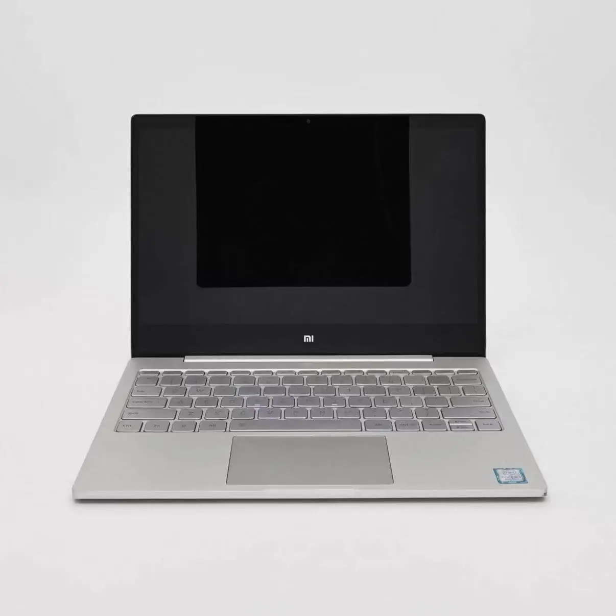 Refurbished Lenovo ThinkPad X260 on desk with stylus and notebook