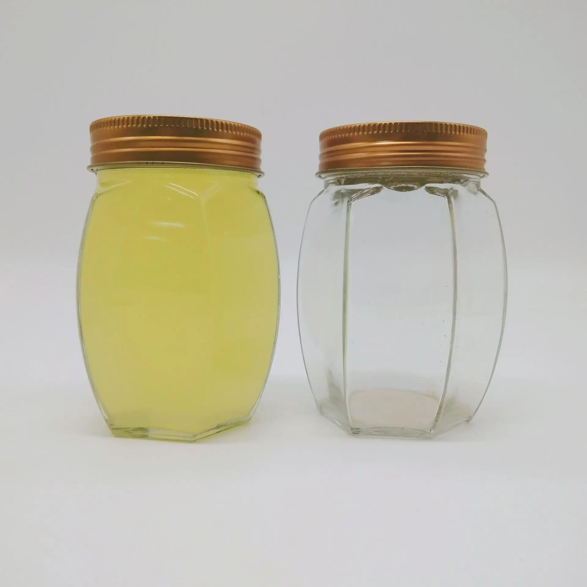毫升,200毫升便宜的玻璃瓶六角蜂蜜设计,带螺丝金属盖子的蜂蜜玻璃瓶