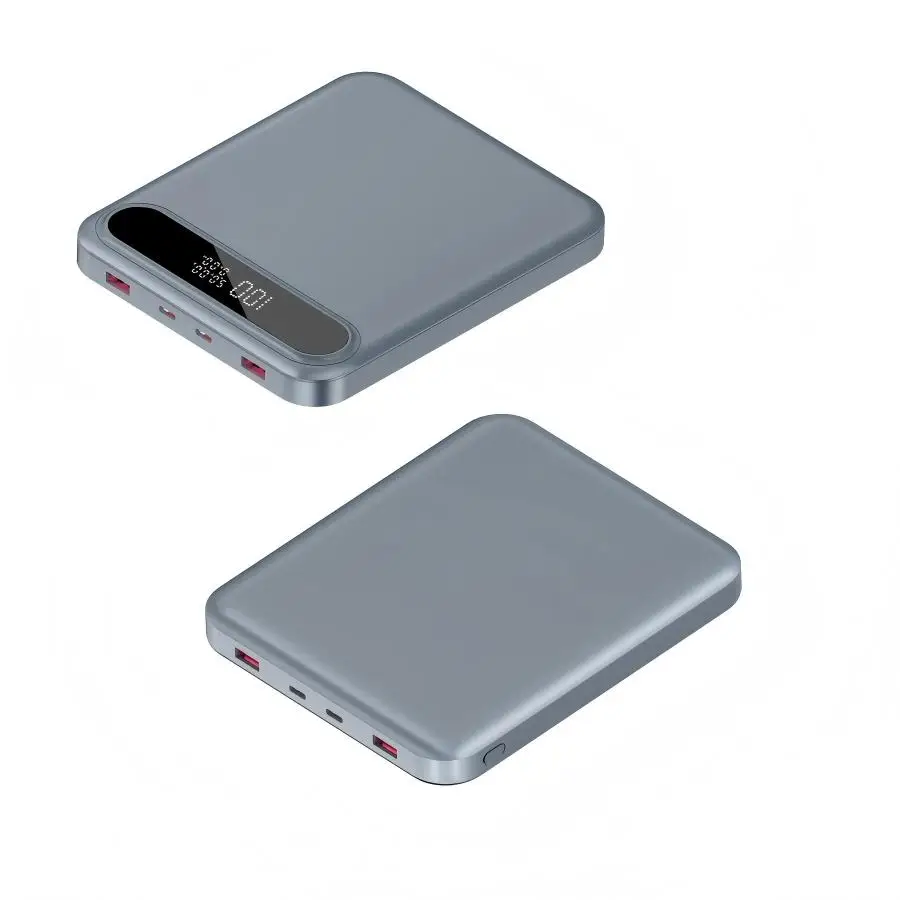 Power bank mounted on laptop lid via magnetic Qi2 pad, charging phone wirelessly while laptop runs