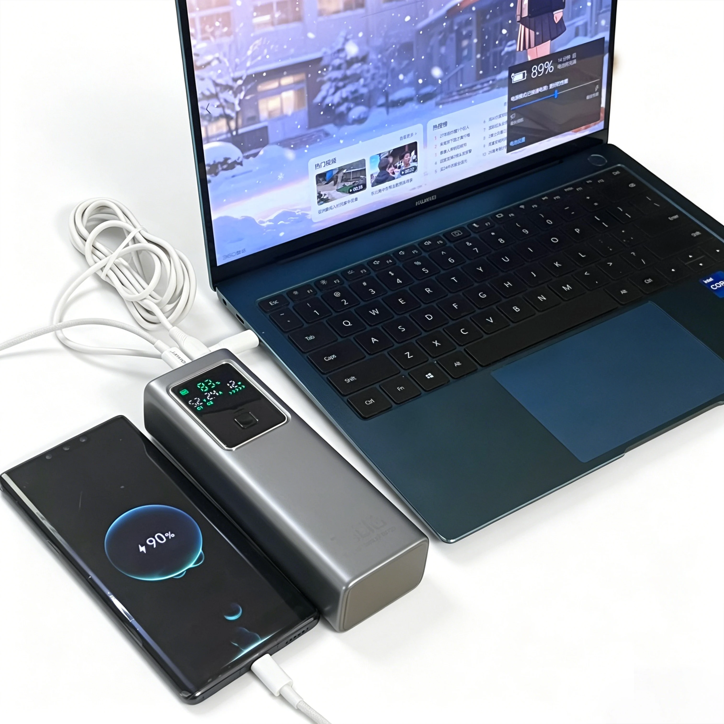 Side-by-side comparison of GaN 140W power bank and legacy silicon 100W unit showing size difference