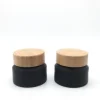 Cosmetic packaging 50ml frosted black slant shoulder glass bottle with bamboo lid