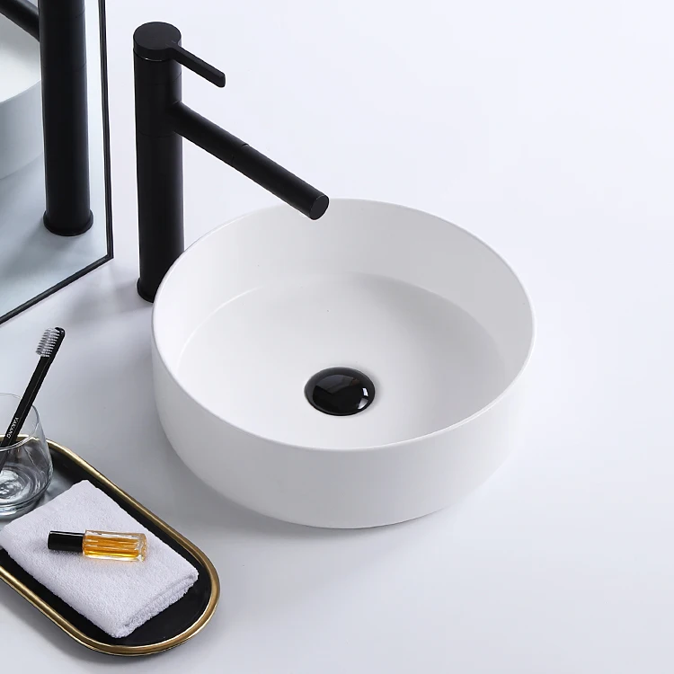 Vanity luxury gold and black color hotel washroom small round art washbasin ceramic table top bathroom sink hand wash basin supplier