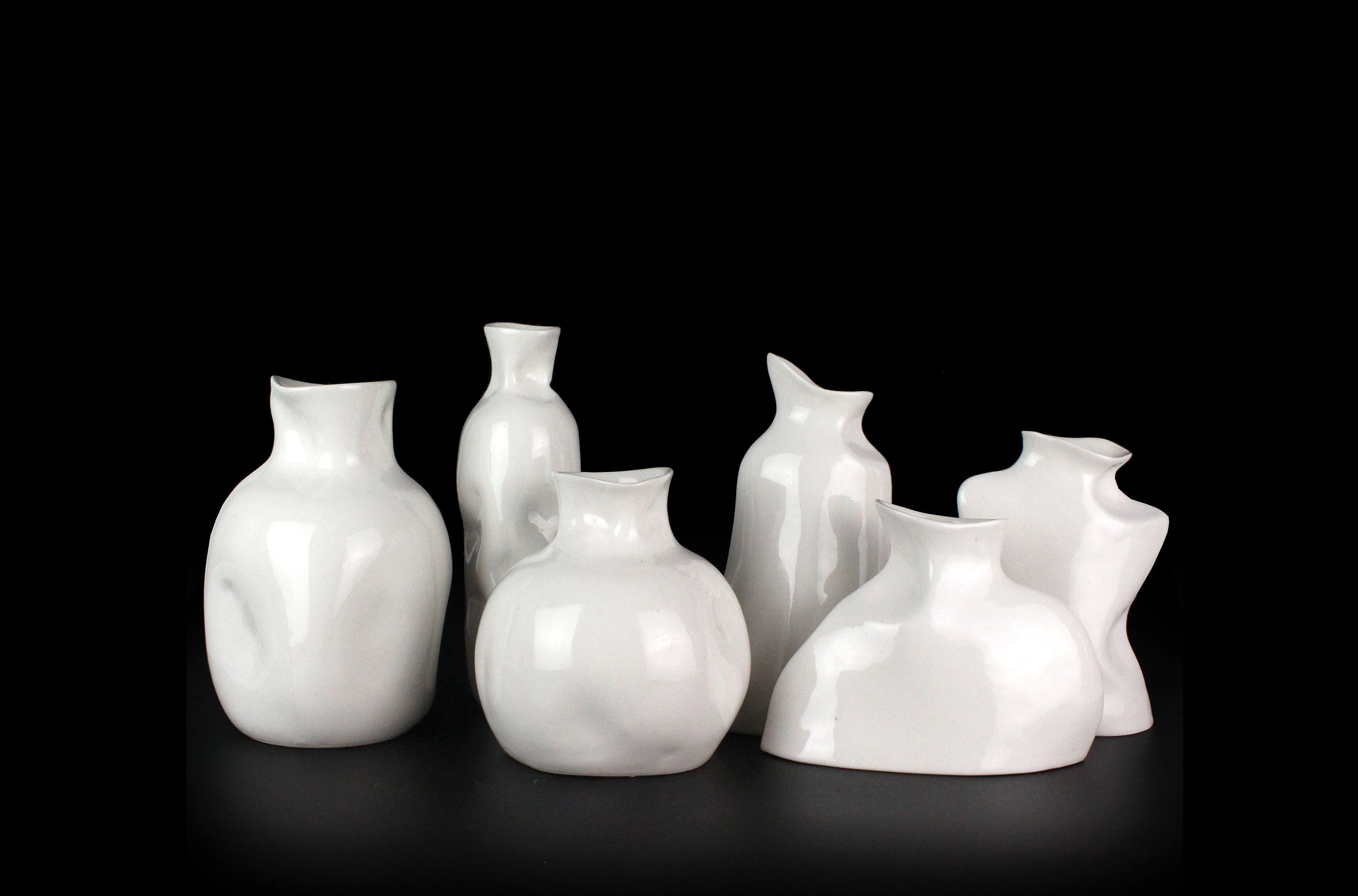 Wholesales Modern Luxury Gross Imitation White Ceramic Irregular Shape  Pottery Flower Vase supplier