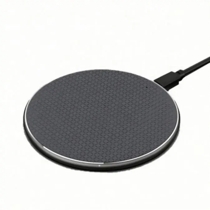 15W wireless charging pad with smartphone placed on top, glowing LED indicator active