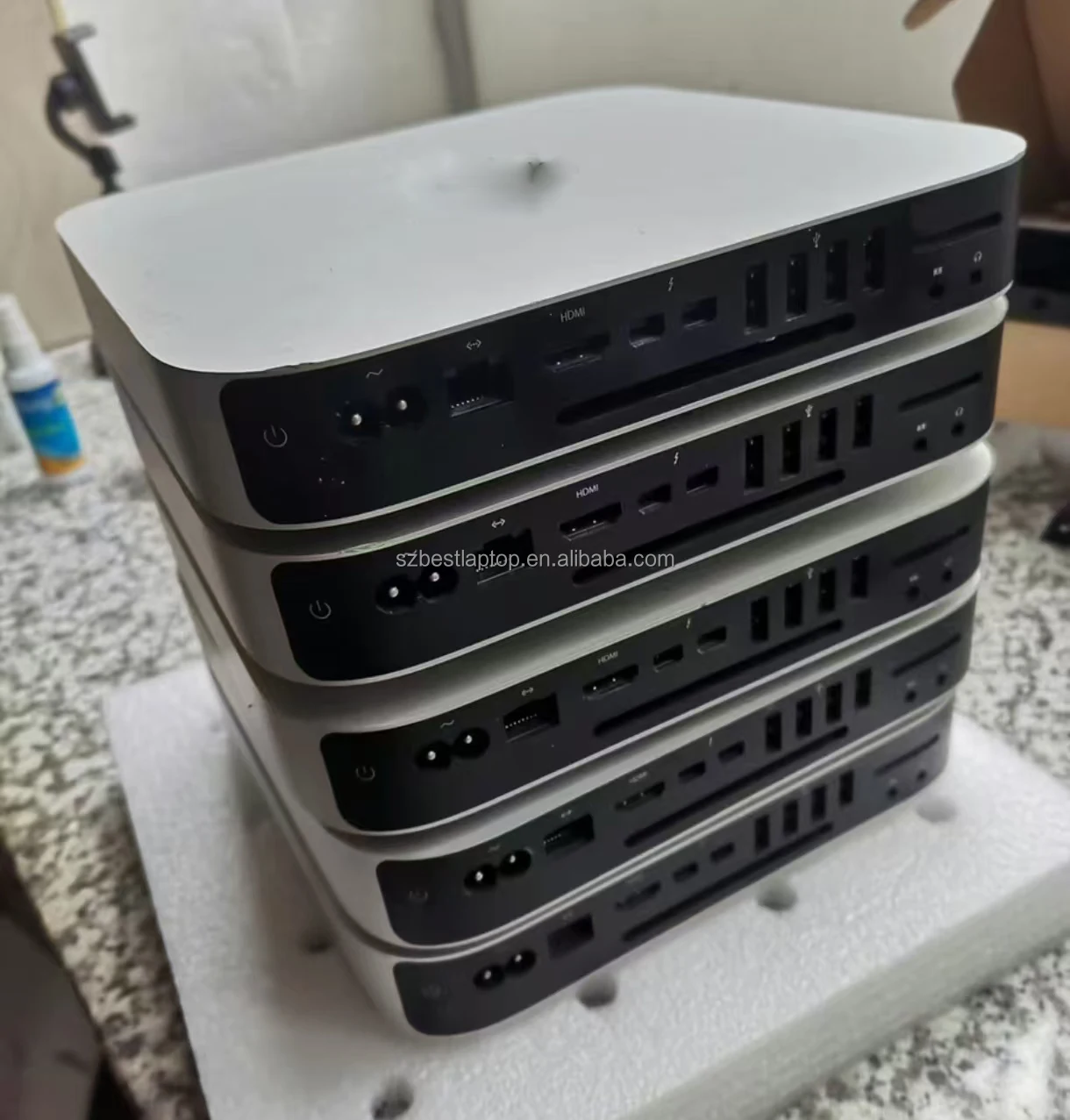 Open 2010 Mac Mini showing DDR3 RAM slots and 2.5-inch SATA drive bay