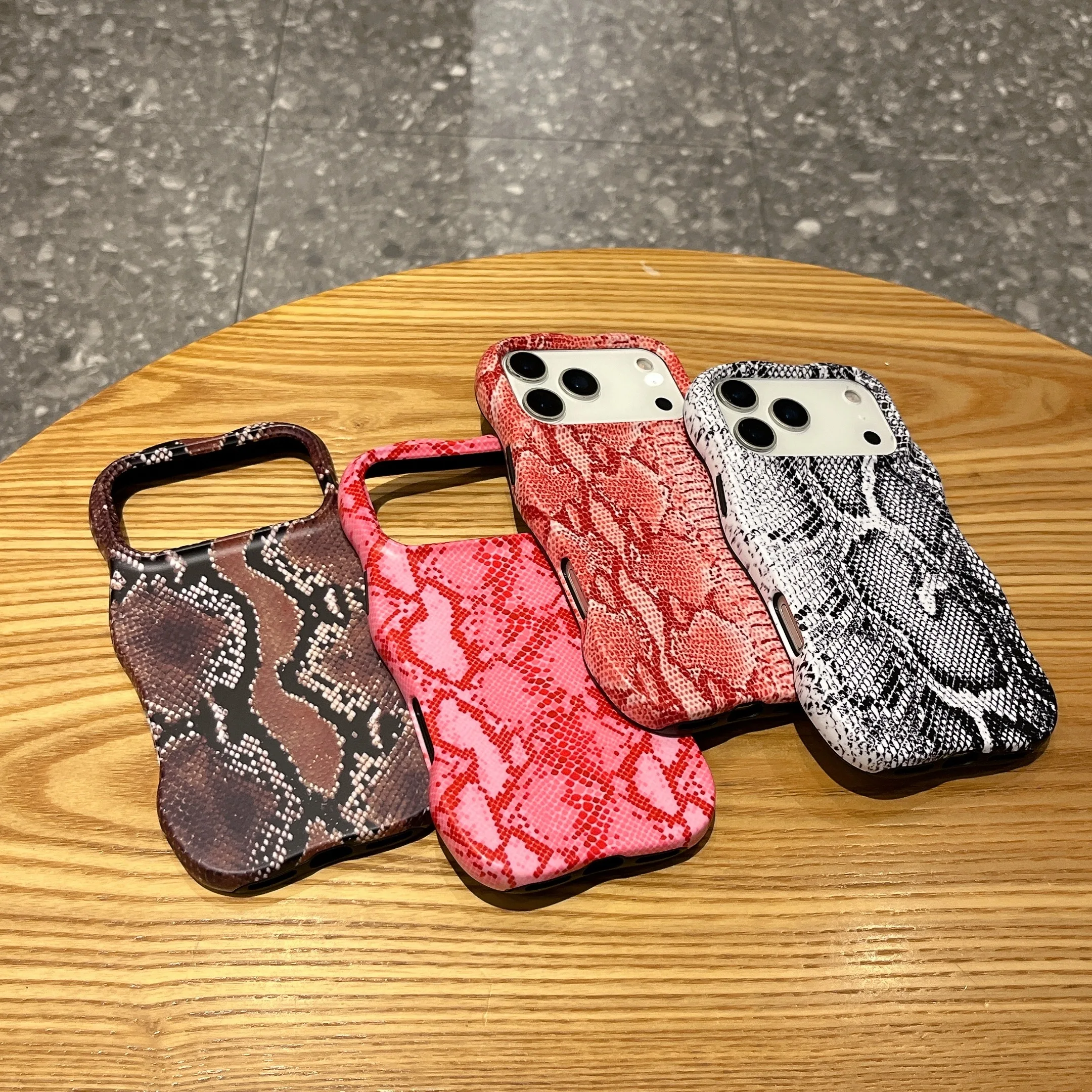 3D-molded snake pattern iPhone case showing raised scale texture and rectangular silhouette