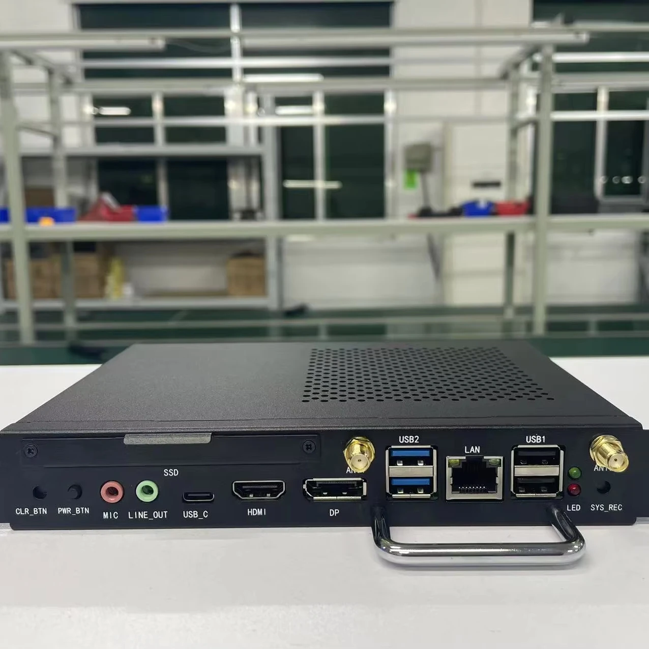 Close-up of mini PC ports including HDMI, USB-C, 2.5G Ethernet, and power input
