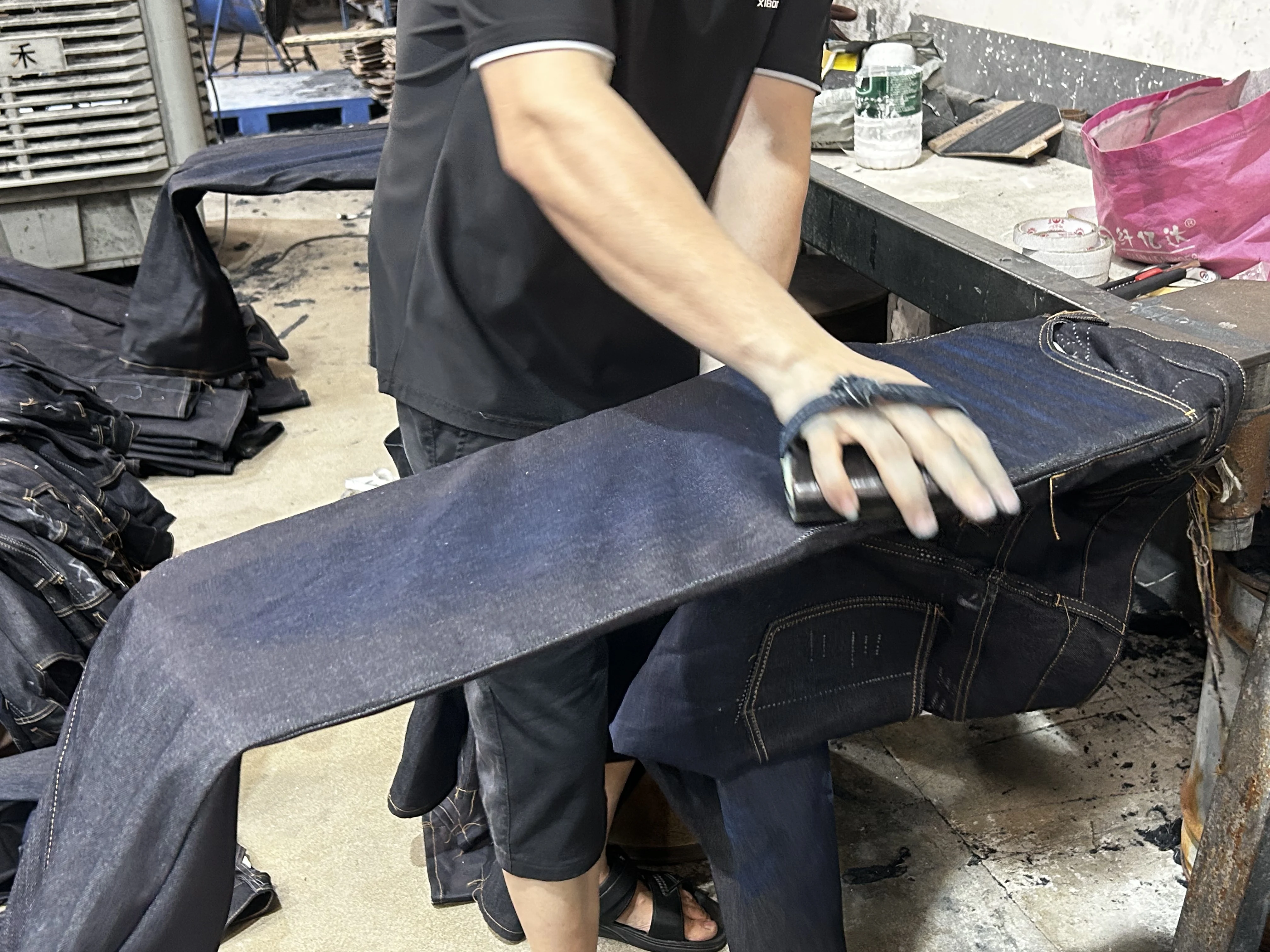 Detail of manual whiskering process—the human touch that makes each piece unique.