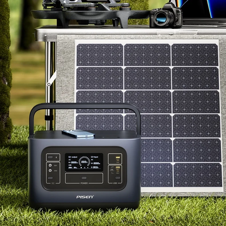 Portable power station connected to solar panels and powering a mini-fridge and laptop simultaneously