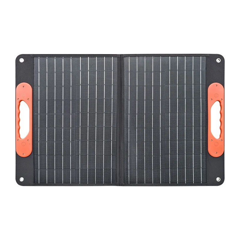 Foldable 12V solar panel kit laid open on grass with Bluetooth controller visible