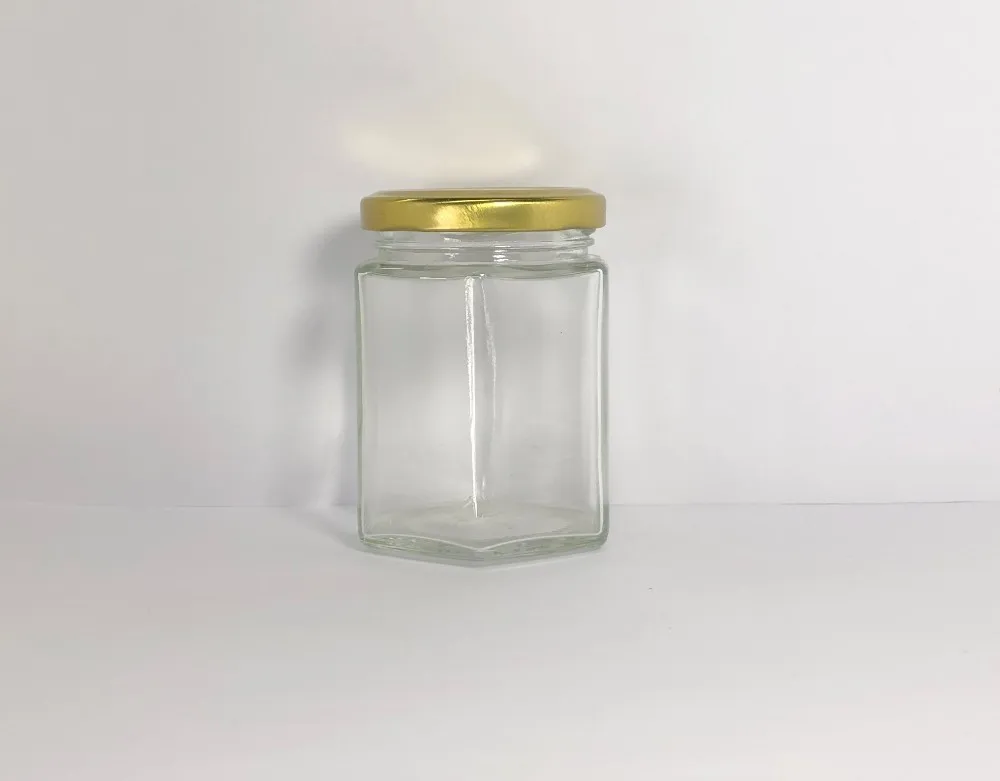 180毫升透明六角玻璃罐与金色金属螺丝盖