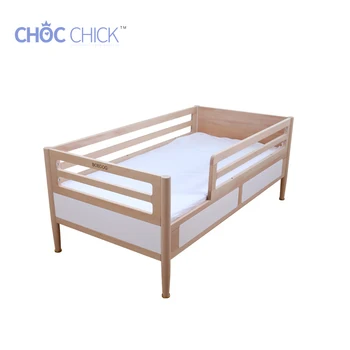 white wooden childrens bed