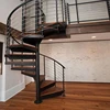 Wooden steps Wide spiral staircase with steel balustrade design