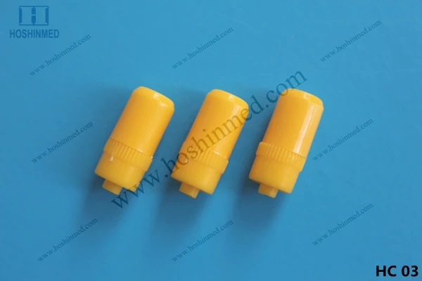 Surgical yellow heparin cap and three way stopcock
