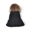 Black warm winter custom knit beanie hat with pompom