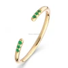 Stainless Steel Shashi Ava Ring In Yellow Gold Emerald