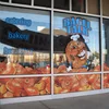 View through perforated adhesive vinyl window graphics