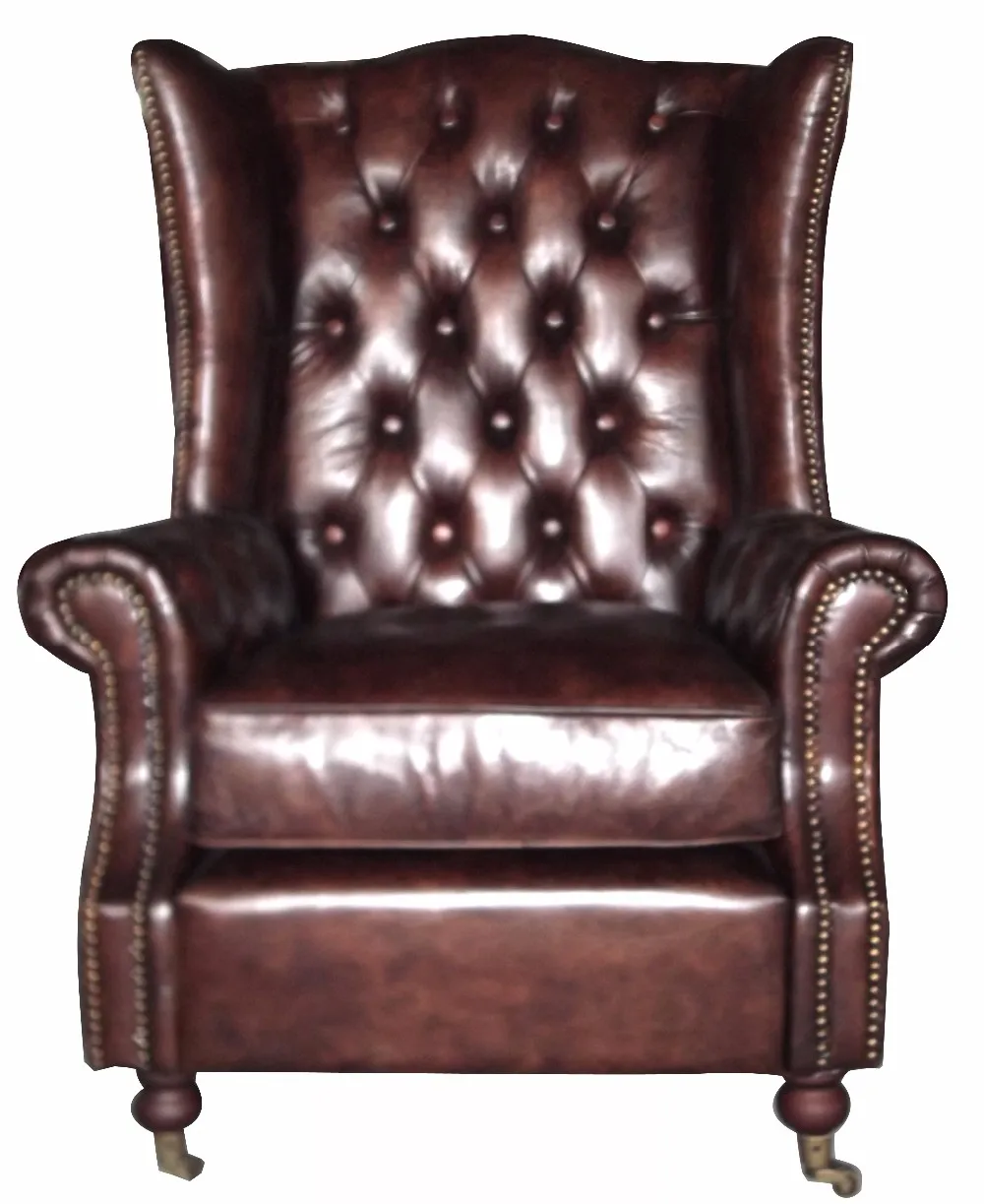 кожаное кресло с заклепками