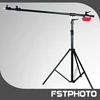 Studio boom stand with other studio accessories such as tripod and background
