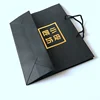Custom gold hot stamping logo printed matt black cardboard shopping paper bag