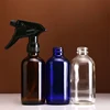 Hot sale amber clear blue 250ml 500ml 750ml empty foam trigger spray pump boston round glass sprayer bottles with trigger