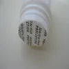 Polystyrene pressure sensitive sealing disk for pharmaceuticals