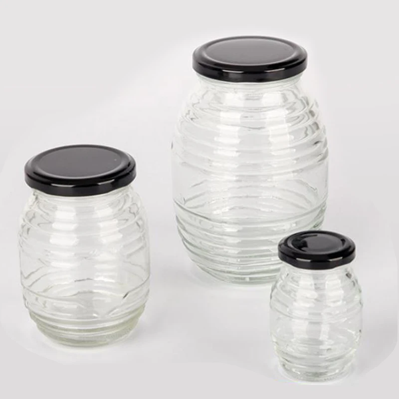 Glass jar for honey Oval glass honey bee bottle with tinplate screw lid