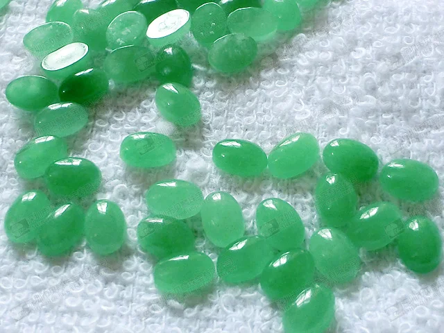 loose stone dyed green jade oval cabochon.jpg