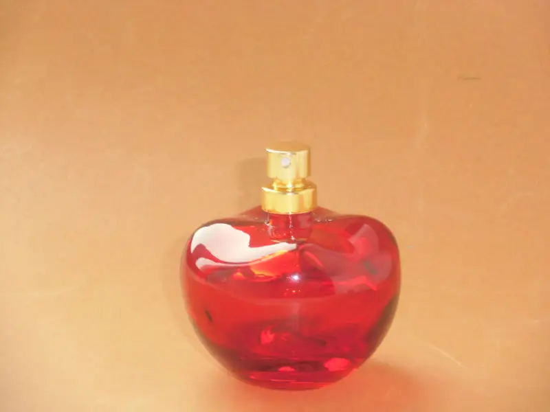 red apple shaped perfume bottle