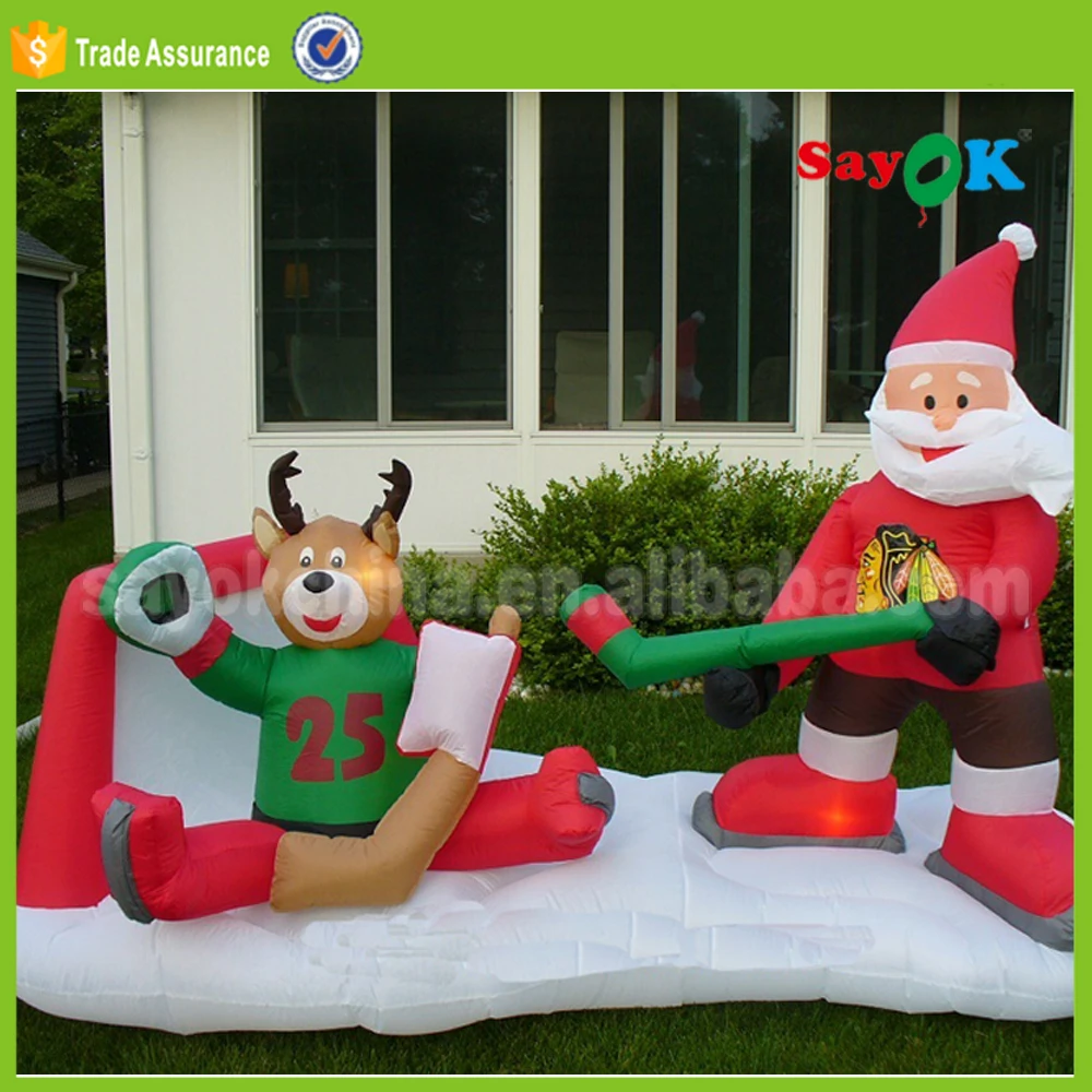 Outdoor Santa Playing Hockey Christmas Inflatable Ice Hockey Stick