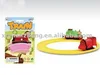 Pre-school children in educational groups mounted track wind-up train