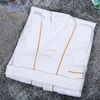 /product-detail/townzi-classical-style-white-waffle-weave-style-gold-100-cotton-hotel-bath-room-linen-bathrobe-custom-60706497809.html